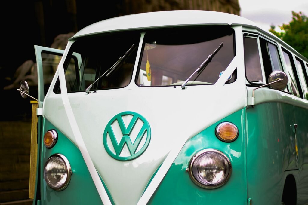 Close-up of a classic Volkswagen combi van with a vintage design in an outdoor scene.